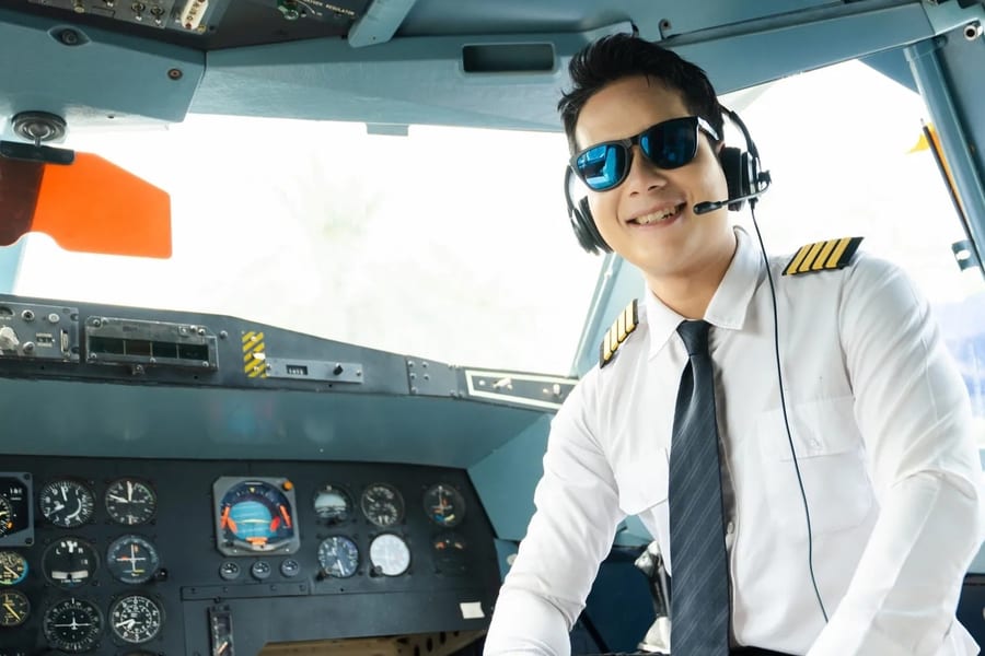 Pilot in cockpit wearing headset during flight